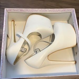 White platform pumps